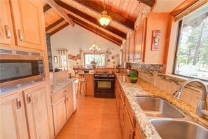 House, Multiple Beds, Hot Tub | Private kitchen | Fridge, microwave, stovetop, dishwasher