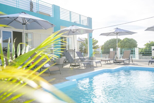 Outdoor pool, pool umbrellas, pool loungers