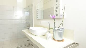 Shower, rainfall showerhead, hair dryer, towels