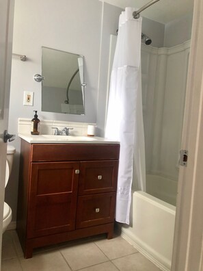 Combined shower/tub, hair dryer, towels, soap
