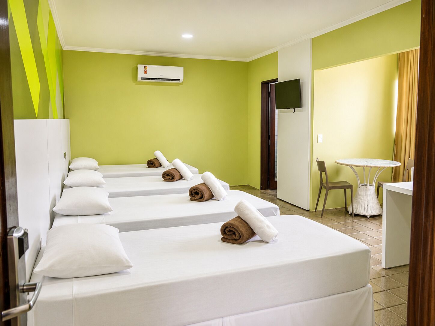 Deluxe Quadruple Room | Hypo-allergenic bedding available, desk, laptop workspace