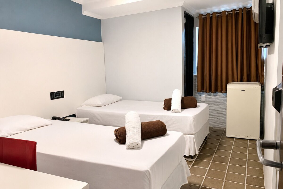 Hypo-allergenic bedding, desk, laptop workspace, blackout curtains