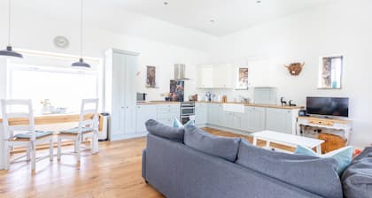 Family friendly country barn cottage on rural farm surrounded by rolling hills