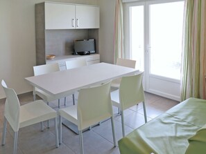 Enjoy meals at the dining table surrounded by comfortable seating for four.