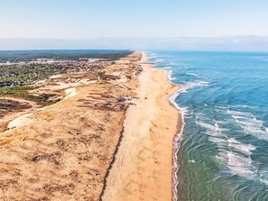 Overlooking a serene coastal beach, this property offers stunning ocean views.