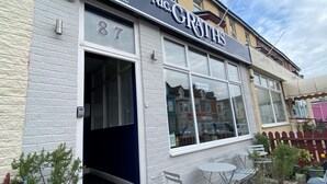 A building with a sign reading "McGrath's Blackpool" and a visible number "87". - McGraths Blackpool (Blackpool)