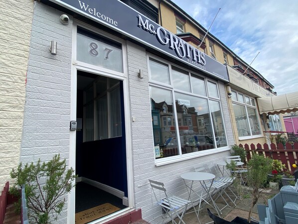 A building with a sign reading "McGrath's Blackpool" and a visible number "87". - McGraths Blackpool (Blackpool)