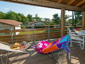 Relax on the deck with a refreshing drink, taking in the views of the surrounding landscape.