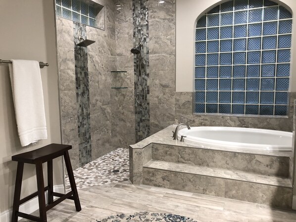 Combined shower/tub, hair dryer, towels, soap