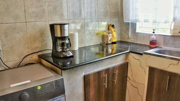 Microwave, coffee/tea maker, cookware/dishes/utensils