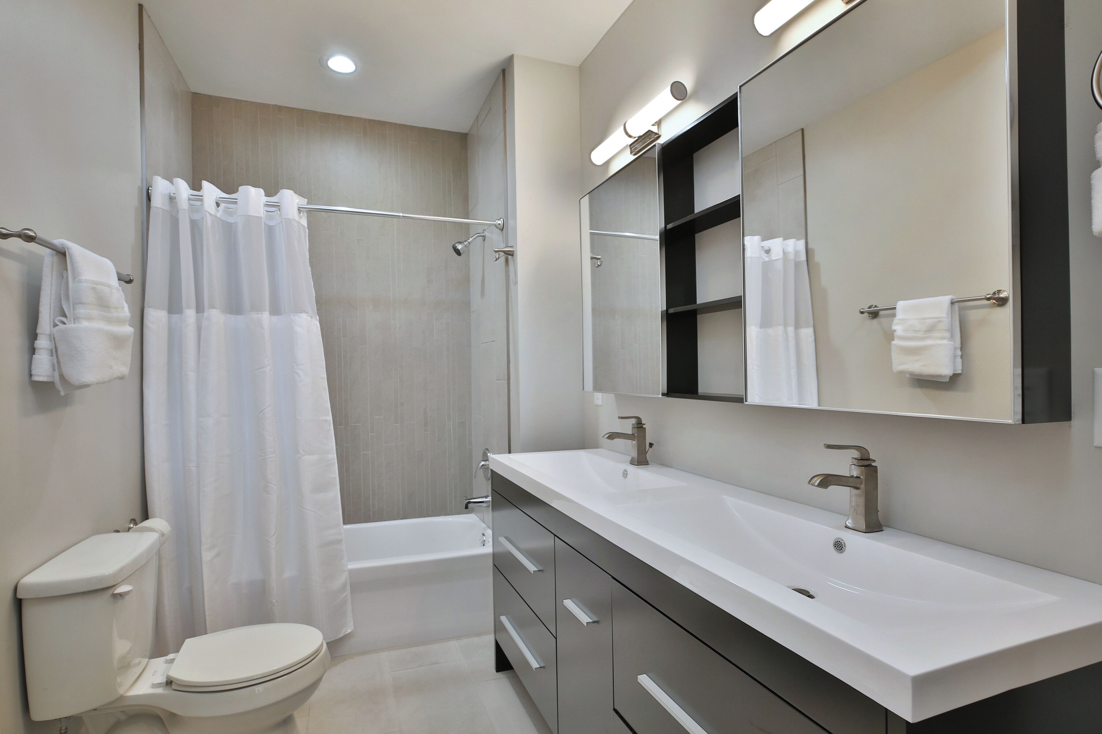 Combined shower/tub, hair dryer, towels, soap