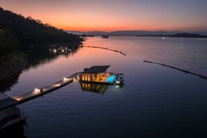 A floating house with a pool, connected to the shore by a dock. - Z9 Resort (Si Sawat)