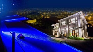 A modern house with a large front yard and a swimming pool. - Moonstone Bed and Breakfast (Sanxing)