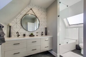 Combined shower/tub, hair dryer, towels, soap