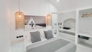 In-room safe, blackout drapes, WiFi (free), bed sheets - Fira Cave Suites (Santorini)