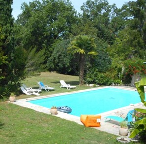 Seasonal outdoor pool, pool loungers