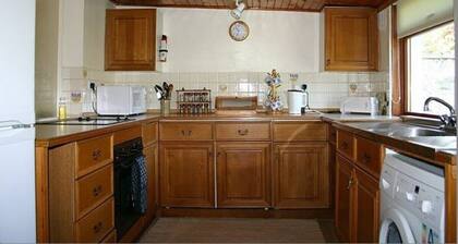 Woodcroft Holiday Cottage in Ayr is set within the lawned, west-facing garden