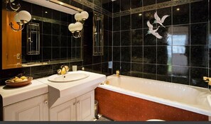 Bathtub, hair dryer, towels, soap