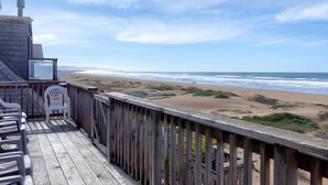 A wooden deck with chairs overlooking a beach. - Steps from the Sand! Spacious Beach Home with Amazing Ocean Views! (Oceano)