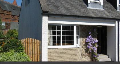 Church Cottage near to sandy beaches, town, garden, private parking and garden