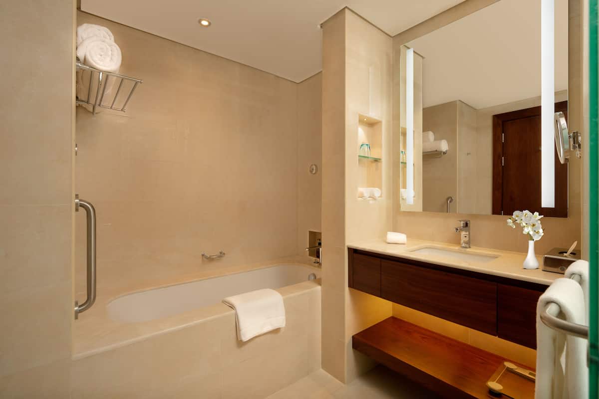 Separate tub and shower, deep soaking tub, eco-friendly toiletries