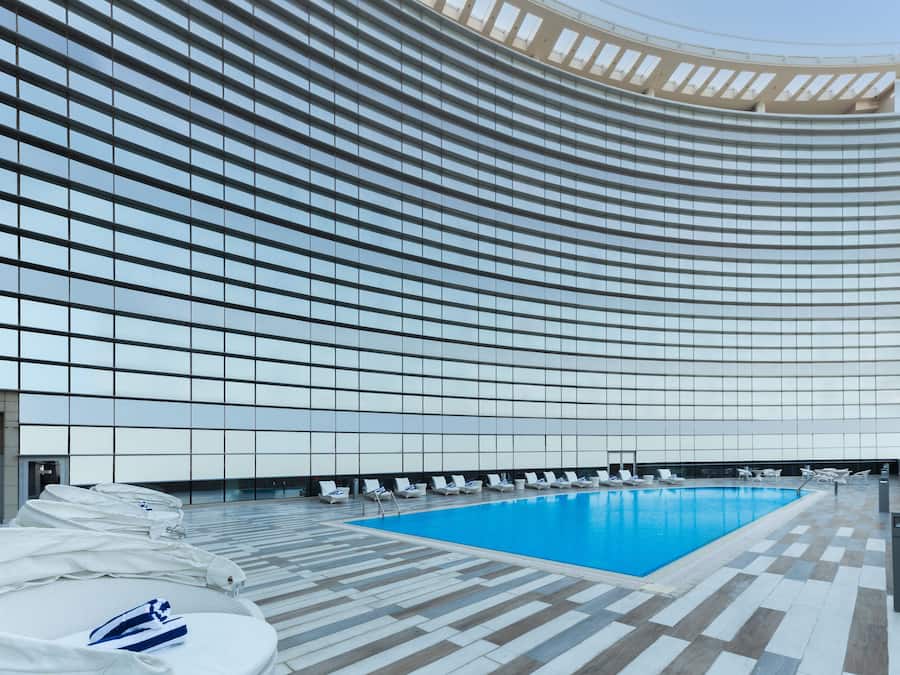 Outdoor pool, open 7:00 AM to 7:00 PM, pool umbrellas, sun loungers