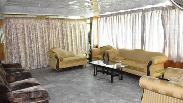 Deluxe Double Room | Living area | TV