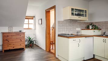 Standard Apartment | Private kitchen | Fridge, stovetop, electric kettle, cookware/dishes/utensils