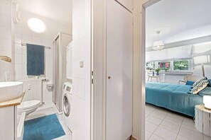 Shower, hair dryer, soap, toilet paper