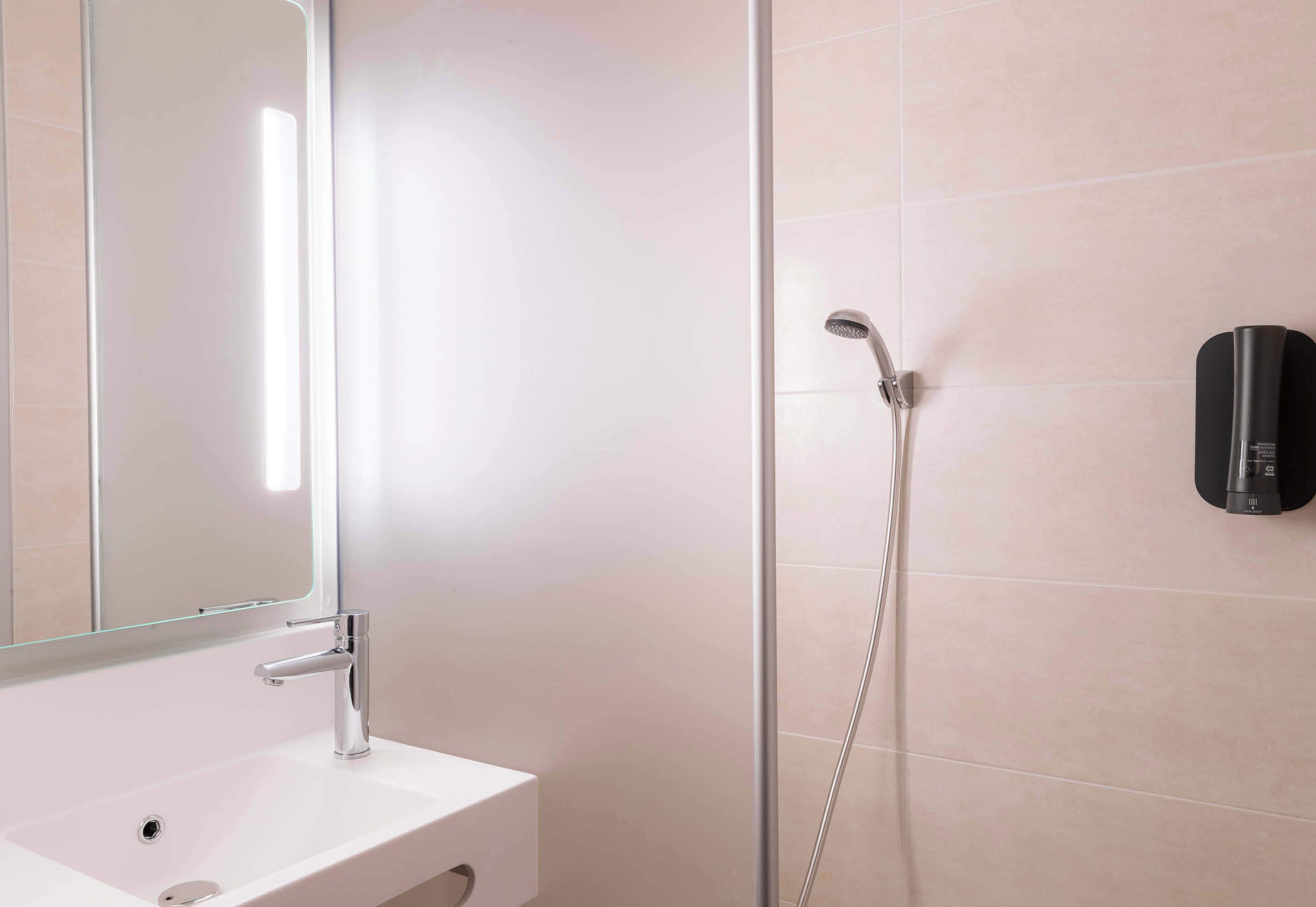 shower, towels, soap, toilet paper