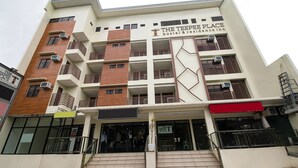 A multi-story building with a sign for 'The TEEPEE PLACE hostel & residence inn'. - Super OYO 832 The Teepee Place Hostel & Residence Inn (Cebu City)