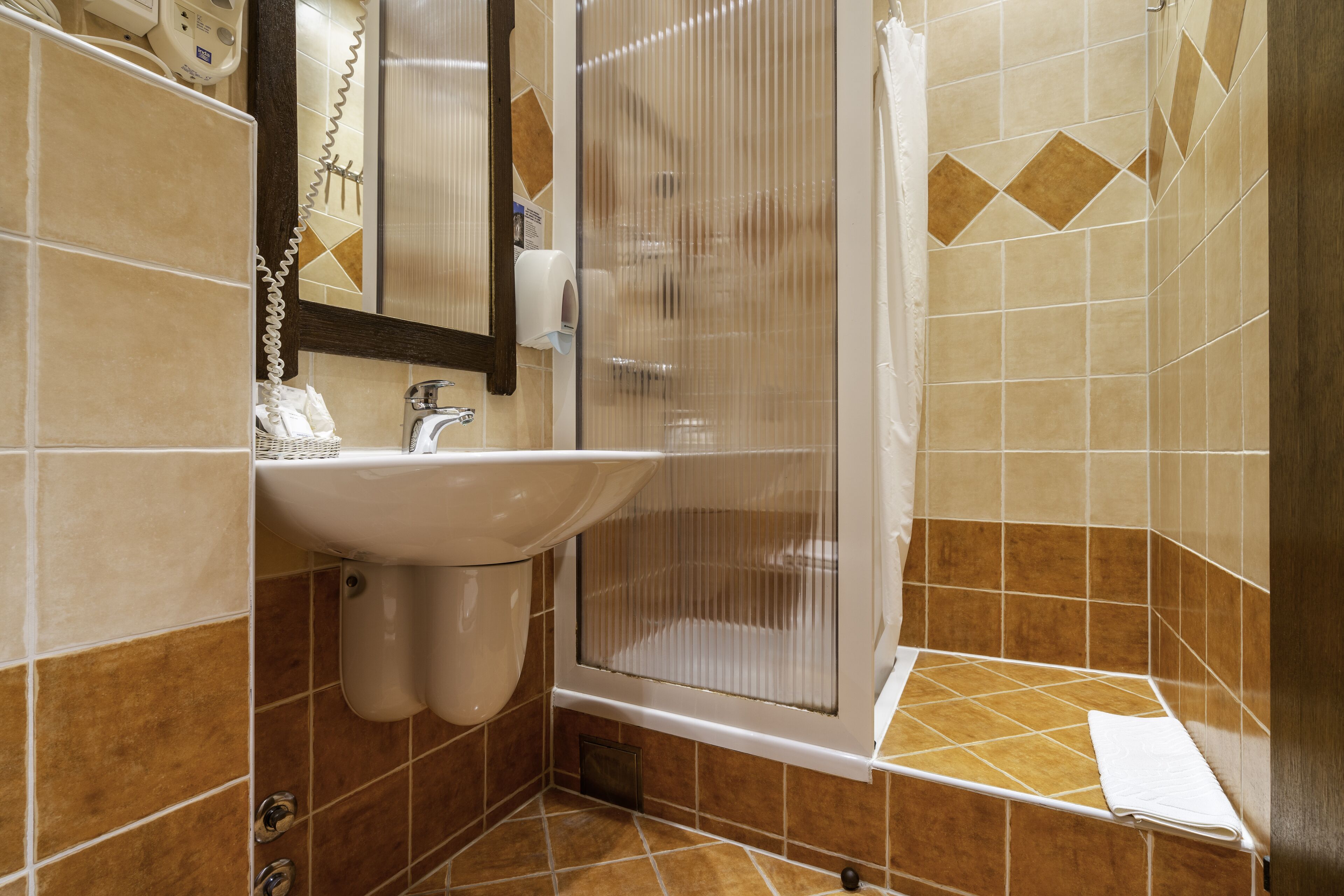 single room | bathroom | shower, hair dryer, towels, soap