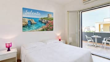 Apartamento, 2 quartos | Wi-Fi de cortesia, roupa de cama