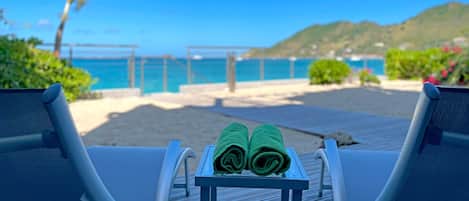 On the beach, sun loungers, beach towels