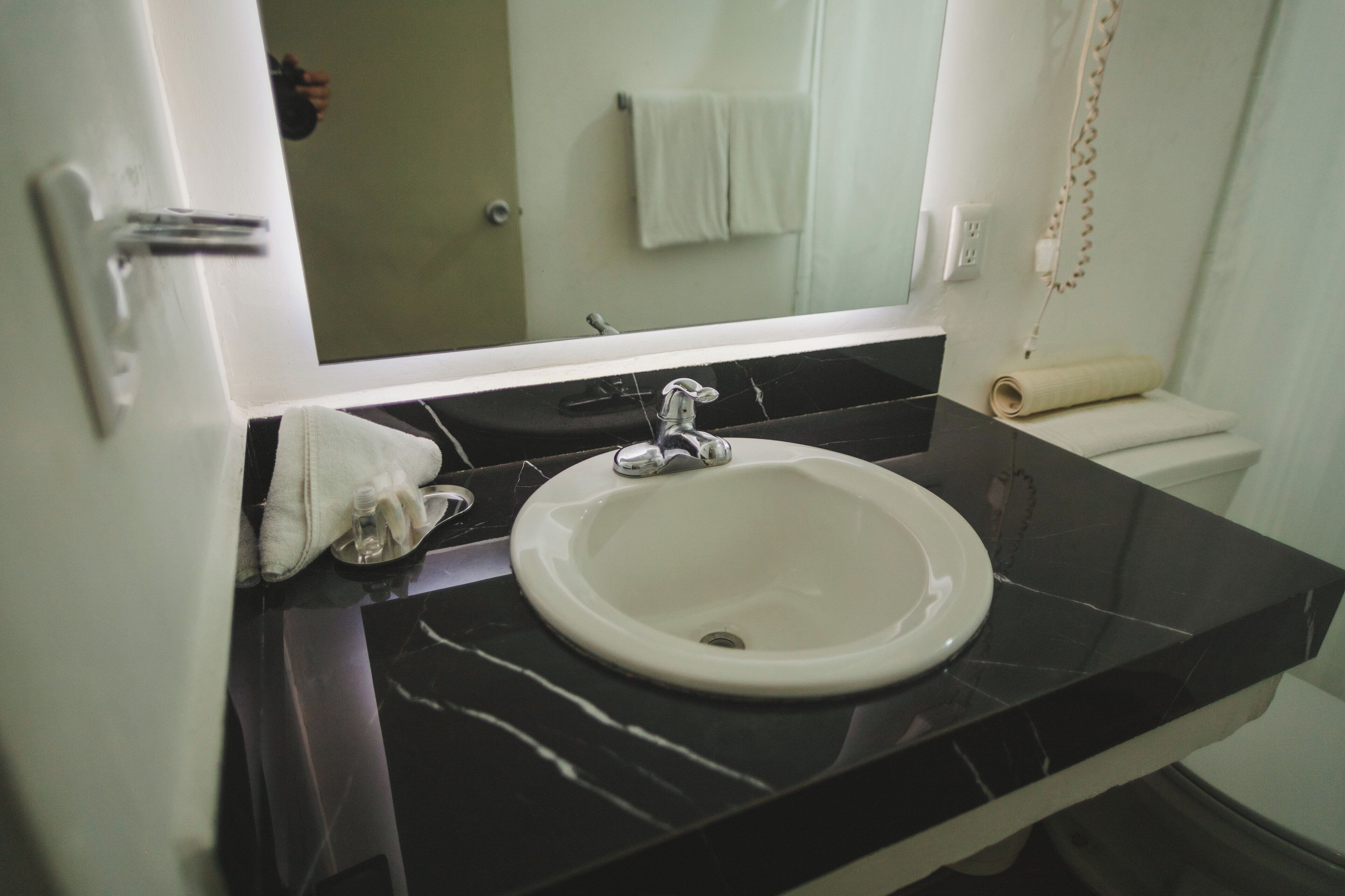 double room, 2 double beds | bathroom | shower, rainfall showerhead, hair dryer, towels