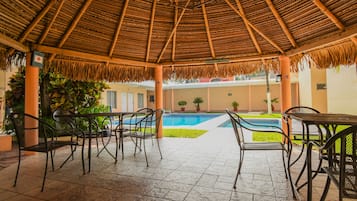 Outdoor pool, open 8:00 AM to 9:00 PM, pool umbrellas