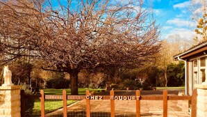 A gated entrance with a sign reading "CHEZ BOUQUET". - Inviting 6-Bed Farmhouse (Cravans)