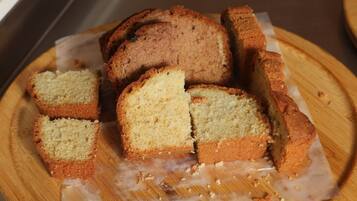 Slices of cake on a wooden board.