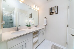 Combined shower/bathtub, towels, toilet paper