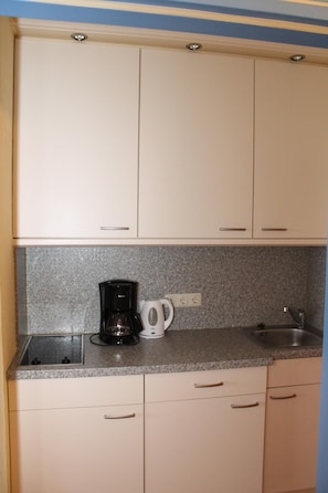 Fridge, microwave, stovetop, coffee/tea maker