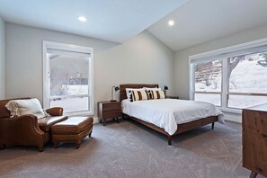 A bedroom with a bed, a nightstand, a chair, and a dresser. - Ski Trip Park City Luxury Townhome w/Hot Tub, Golf Course Views and Open Space (Park City)
