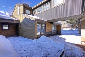 A modern house with a covered patio and snow accumulation. - Ski Trip Park City Luxury Townhome w/Hot Tub, Golf Course Views and Open Space (Park City)