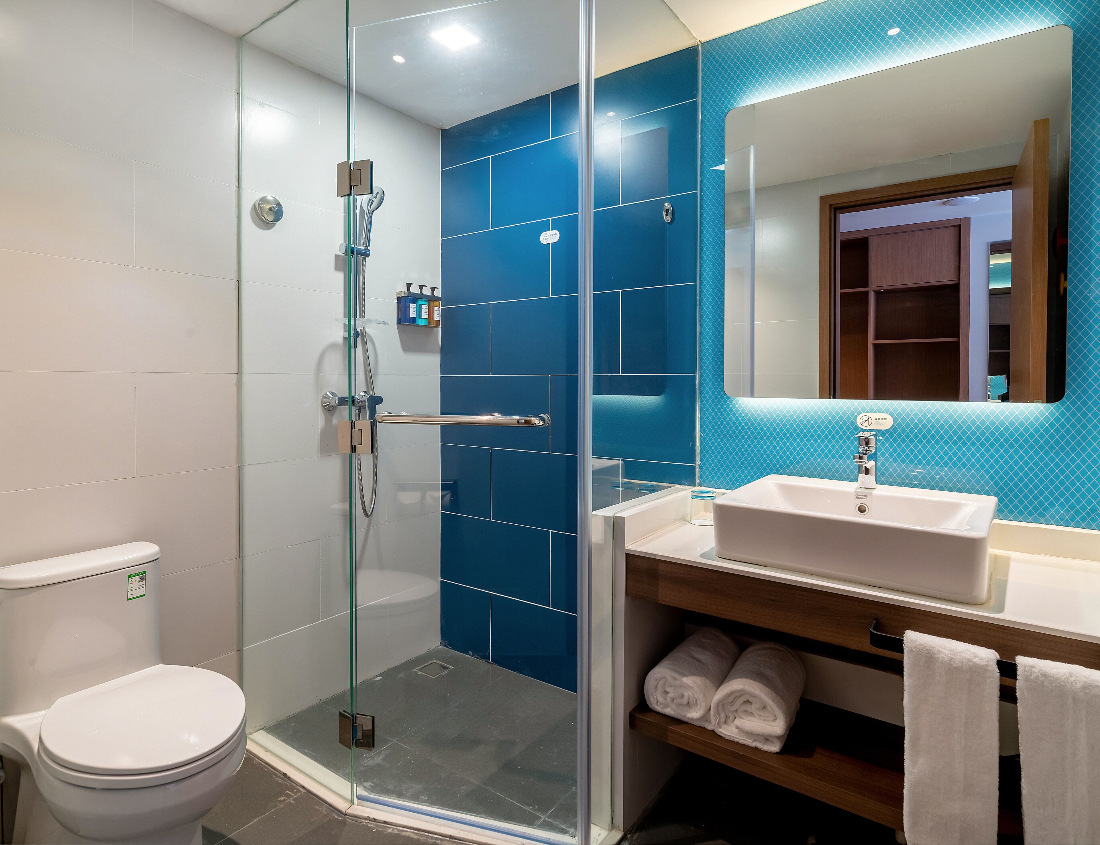 Shower, hydromassage showerhead, designer toiletries, hair dryer