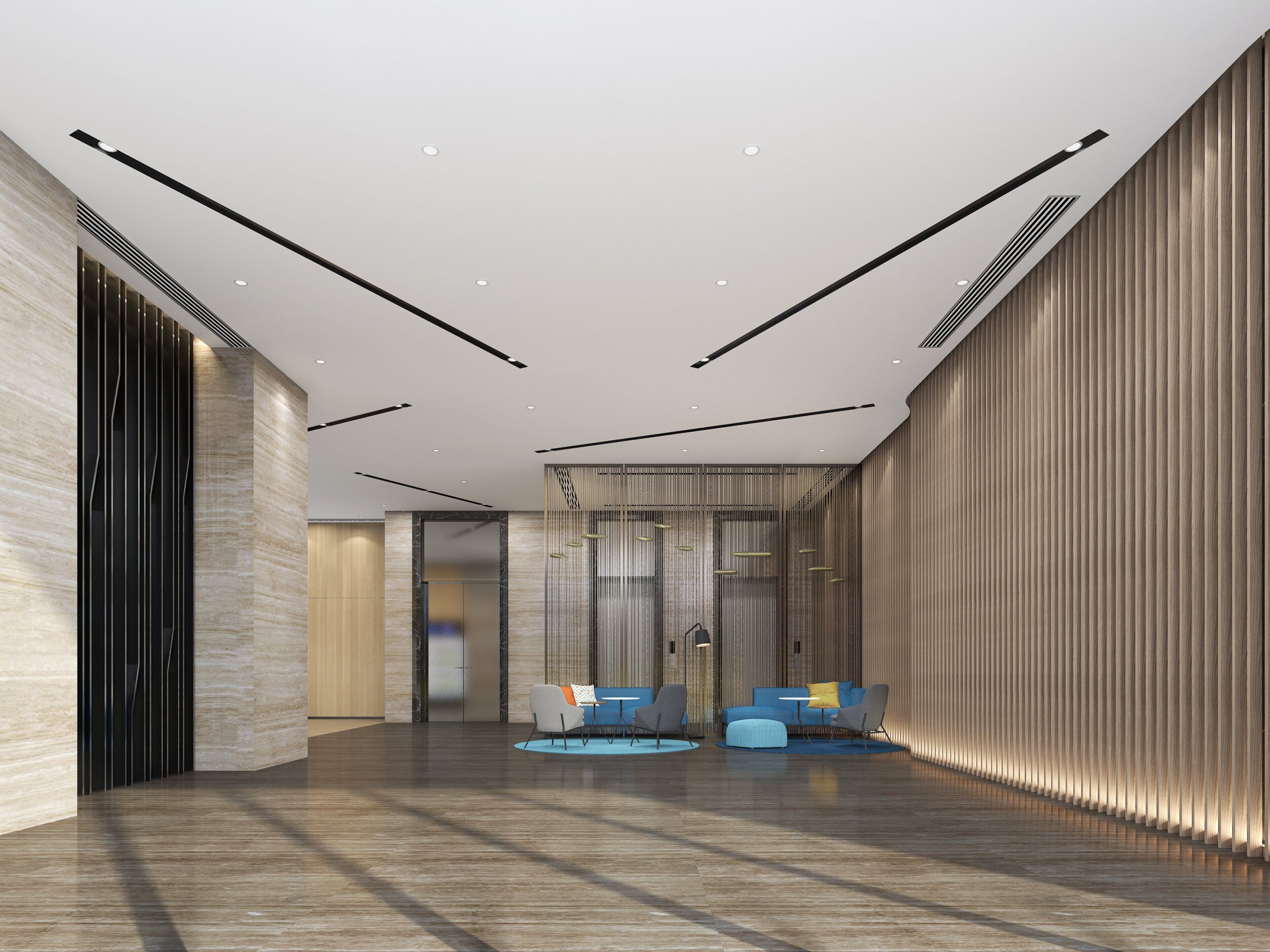 A modern lobby with a high ceiling, recessed lighting, and a seating area with sofas and chairs.