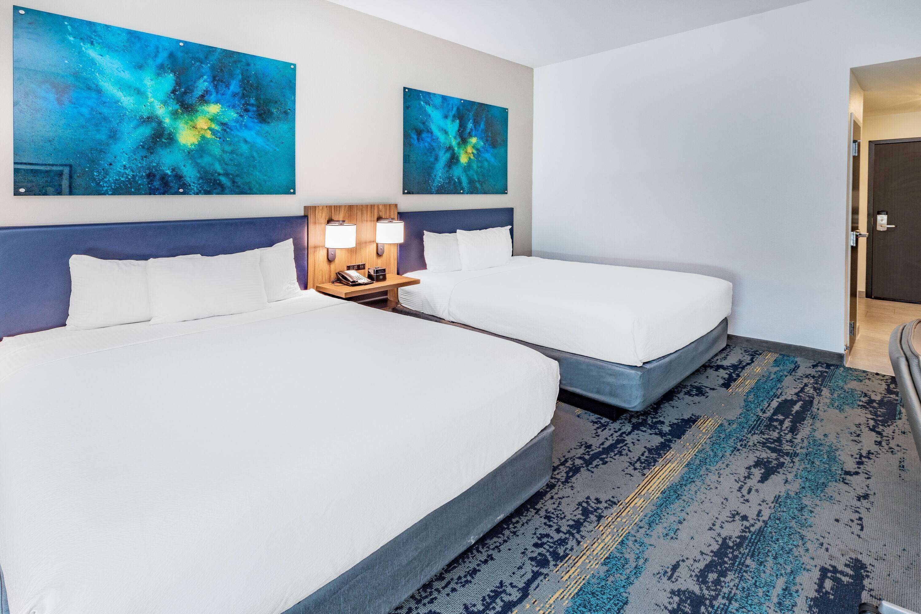 pillow-top beds, desk, laptop workspace, blackout curtains