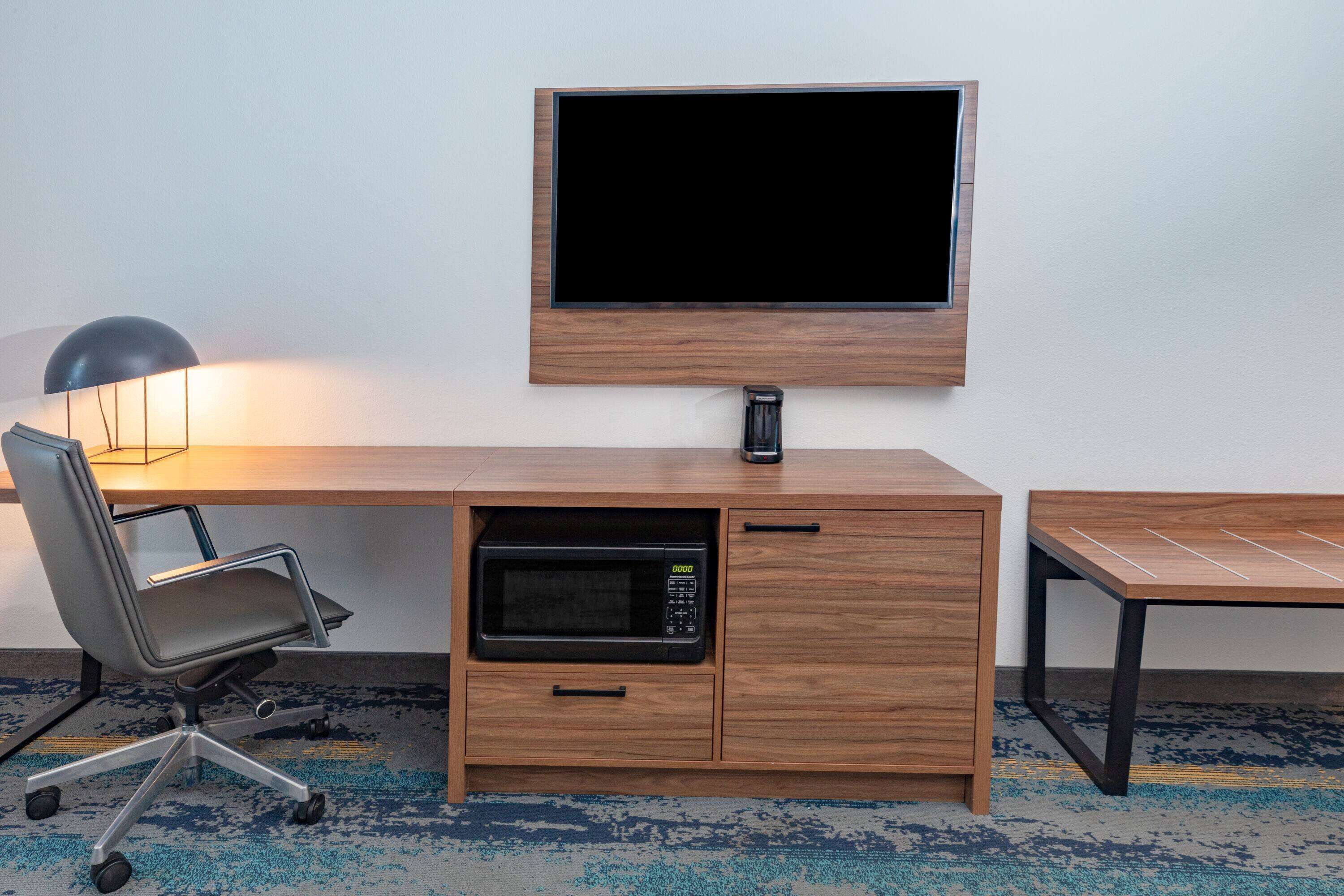 pillow-top beds, desk, laptop workspace, blackout curtains