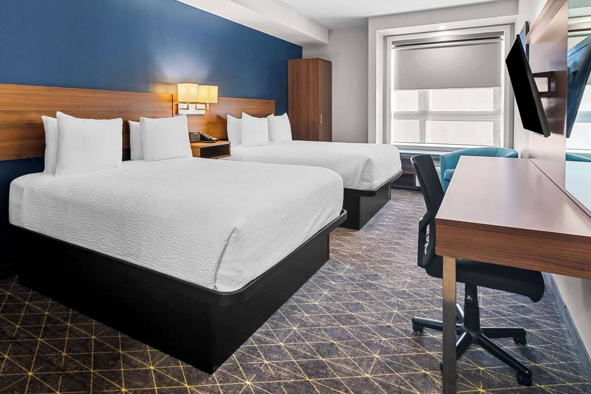 premium bedding, pillow-top beds, desk, laptop workspace