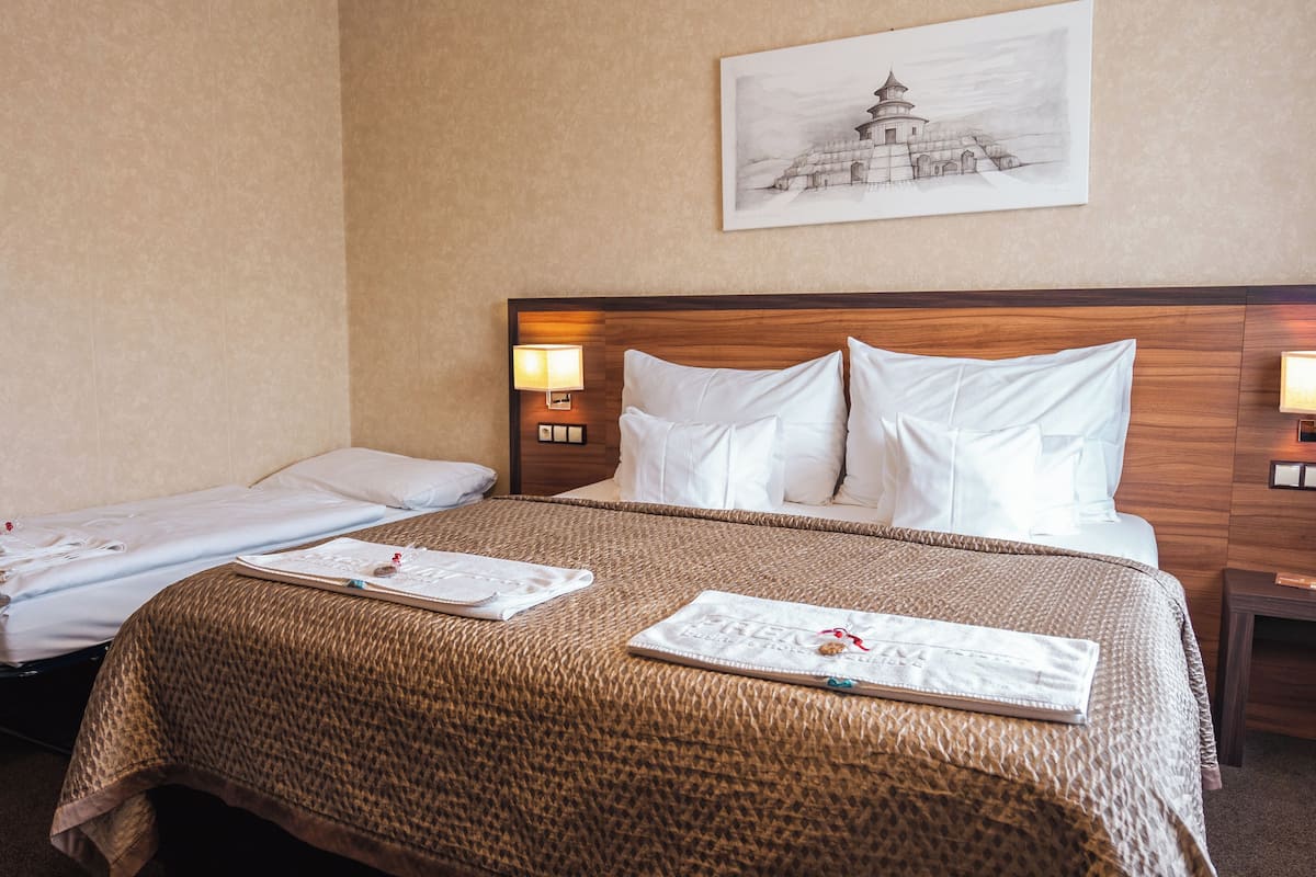 Triple Room (Extra bed) | Minibar, in-room safe, desk, laptop workspace