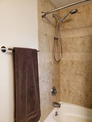 Combined shower/tub, hair dryer, towels, soap