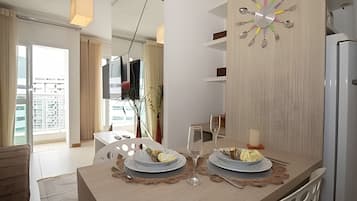 A modern dining area with a central island, a decorative wall clock, and a view of the city through large windows.